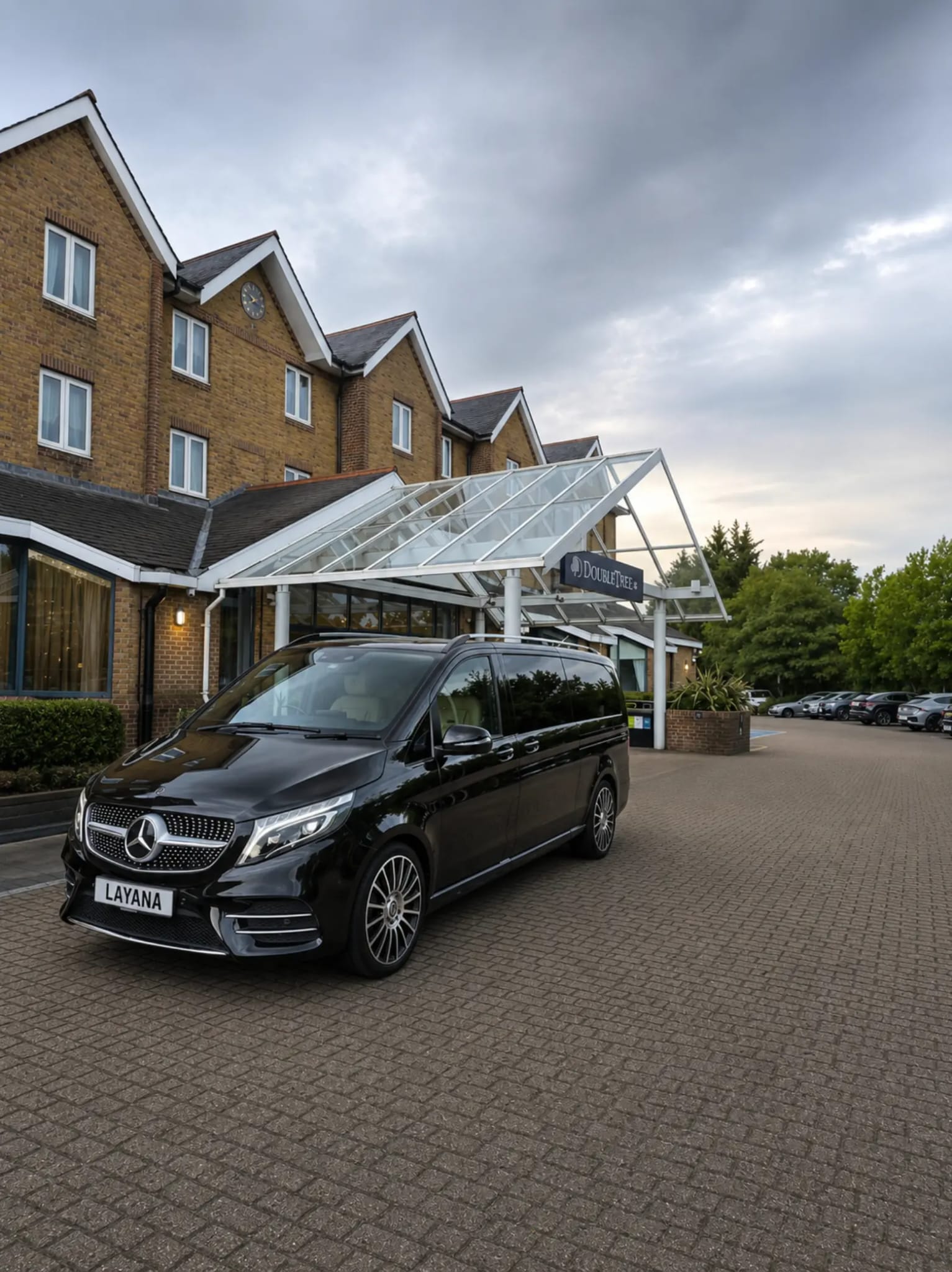 The Layana Mercedes V-Class parked outside a hotel